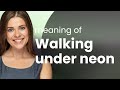 Walking Under Neon Illuminating The Phrase