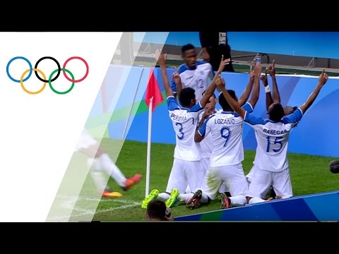 Honduran players pray on the pitch after progressing to the semi-finals