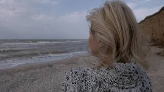 FREEDIO: "Sad woman in beach" royalty free HD stock video footage