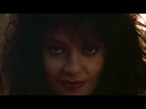 Purple Rain trailer still: Prince as The Kid on a purple motorcycle outside First Avenue