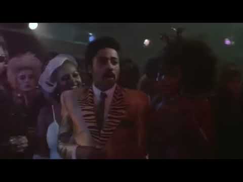 Purple Rain trailer montage: the Kid on stage, Apollonia watching, crowd in purple light