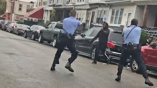 video: Driver runs over policeman during protests after fatal shooting of black man in Philadelphia