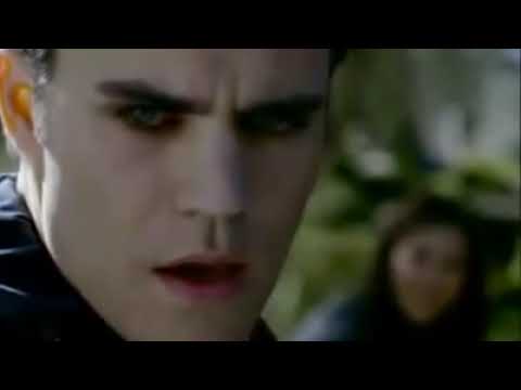 The Vampire Diaries (2009) official CW trailer frame with Elena, Stefan, and Damon over Mystic Falls fog