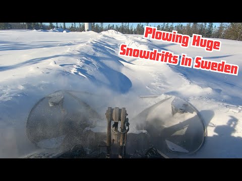 Volvo L60h Busting Big Snow Drifts after Snowstorm