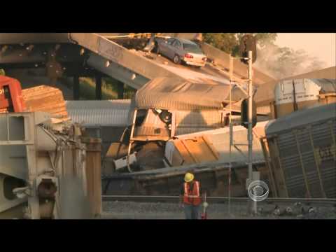 Train collision brings down highway overpass