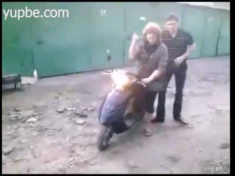 Russian Lady Rides Scooter Into Wall