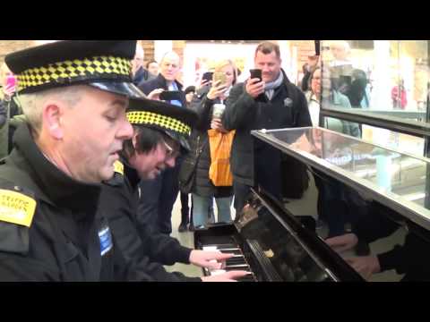 , title : 'Traffic Police Learning How To Play The Piano'