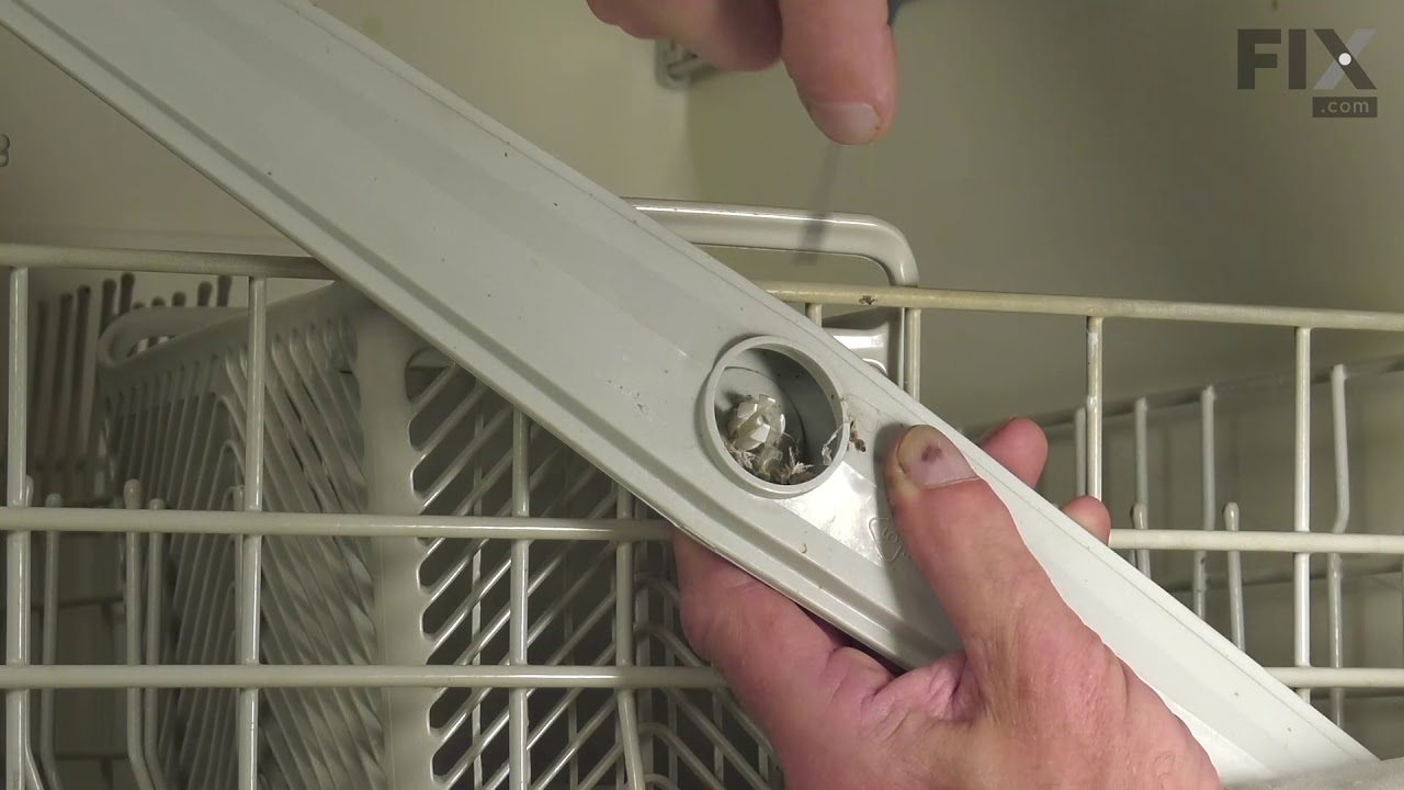 Replacing the Upper Spray Arm Assembly