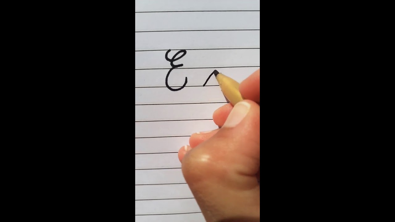 How to write E letter in Cursive Writing.