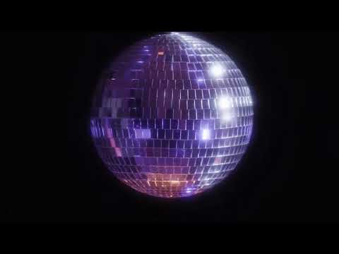 Disco Ball. Real Mirror Ball Party Light cast onto TV