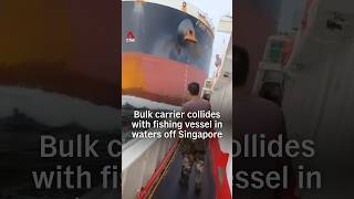 Panama-flagged bulk carrier strikes Chinese fishing vessel off Singapore, crew holds on as waves sweep deck