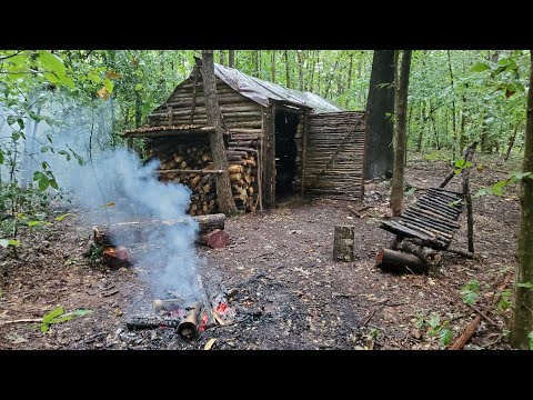 Bushcraft Log Cabin Camping in Rain Storm - Repairing and upgrading my survival shelter with my son