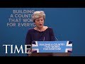 The Letter 'F' Falls From The Conservative Party Sign In Background During Theresa May Speech | TIME