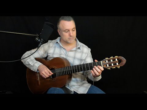 How to hold the acoustic guitar.