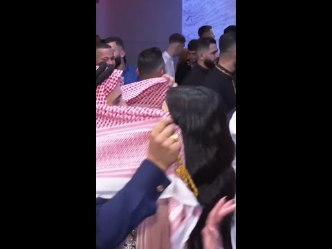 Arab sheikh dancing with girls in night club