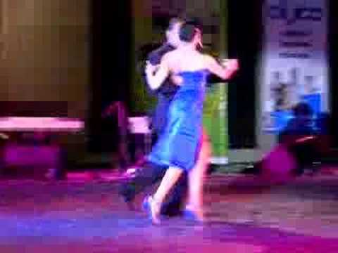  Diego Benavidez  and  Natasha Agudelo  are  dancing  to  the  tango  "  Milongueando En El Cuarenta  "