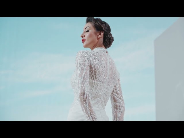 فستان سهره تول شك كامل بالكريستال بأكمام طويله و كريب مع درابيه