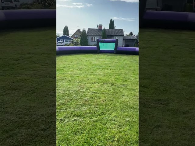 1458317 Inflatable soccer field with fans see video