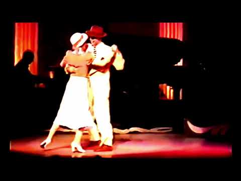  Roberto Herrera  and  Vanina Bilous  are  dancing  to  a  tango
