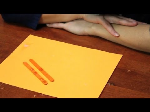 Part of a video titled How to Get Rid of the String When Using a Hot Glue Gun - YouTube