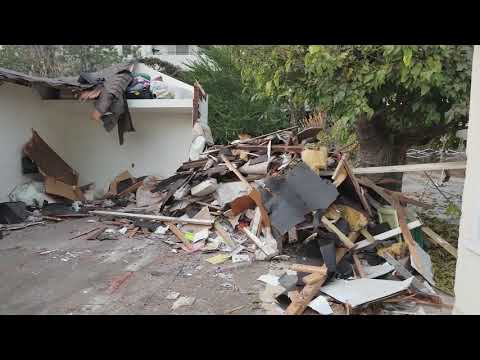 Garage Demolition with Bobcat  S590 skid steer