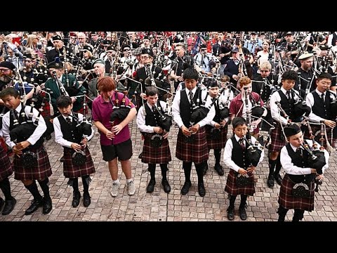 Video Thumbnail: Bagpipers in Melbourne set world record with AC/DC performance