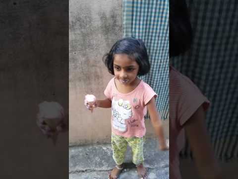 Small girl is eating  ice cream