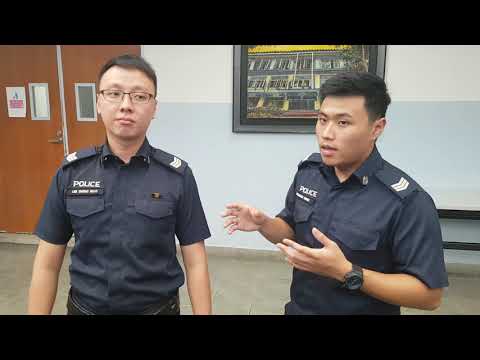 Sergeant Desmond Heng demonstrating how he brought the man to safety while in the water