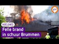 Vlammen slaan metershoog uit grote schuur in Brummen