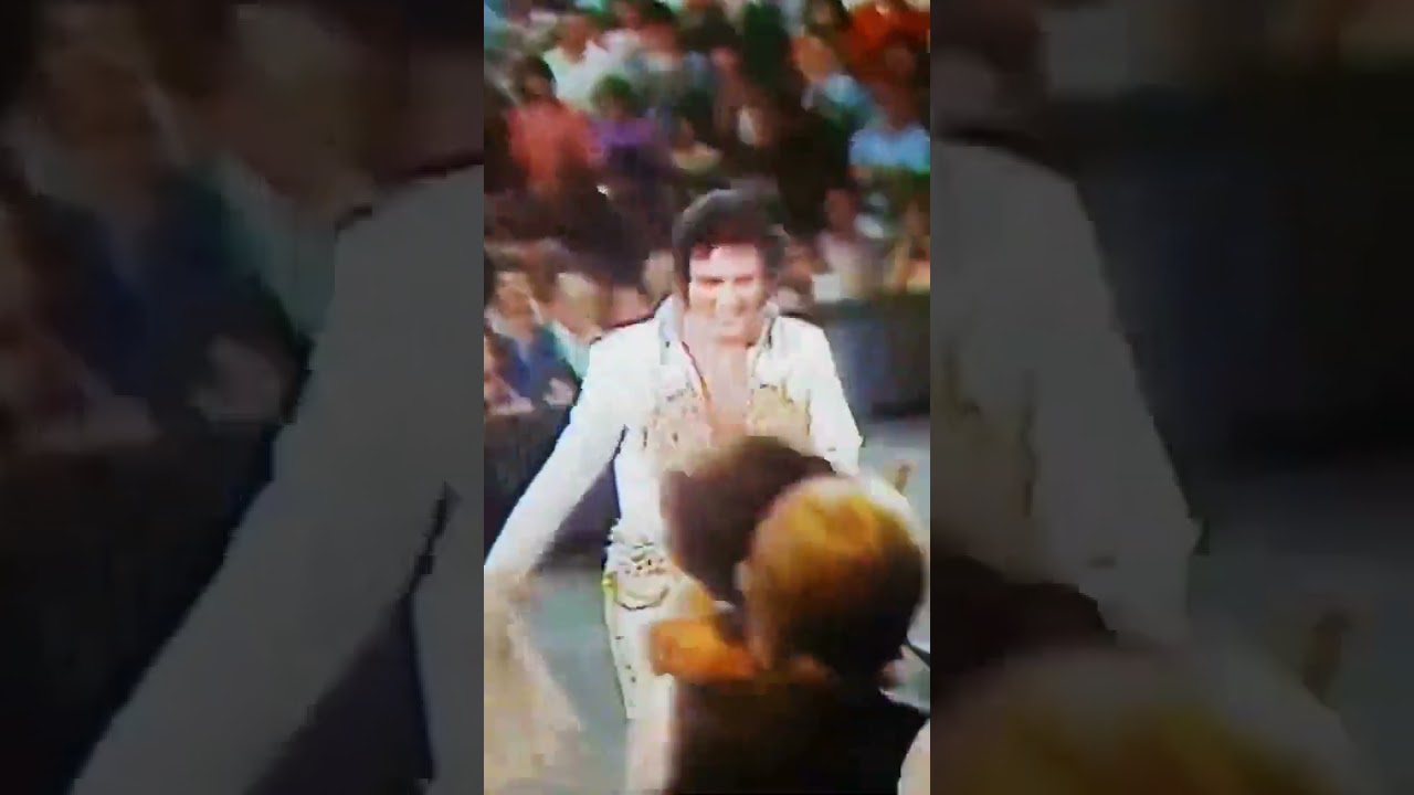 LOOK AT HIS HANDS ITS A KARATE SIGNAL THE LAST TIME ANYONE EVER SAW ELVIS