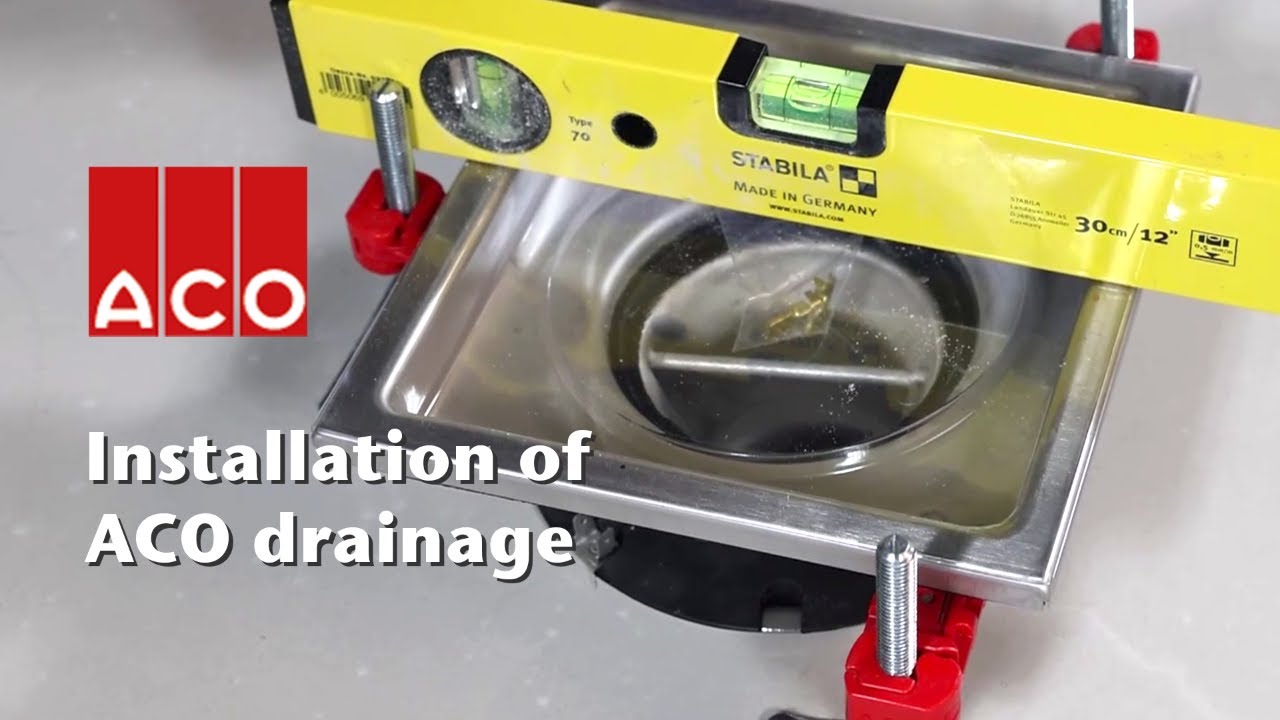 ACO stainless steel commercial gully installed with polyurethane cementitious screed floor