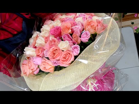 Part of a video titled How to make 100 roses gift hand tied bouquet - YouTube