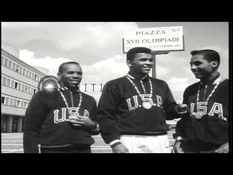 Edward Crook, Cassius Clay (later Muhammad Ali), and Wilbert McClure win gold med...HD Stock Footage