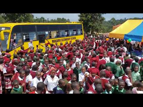 Makairo Secondary School students jig after receiving a brand new bus donation by Hon Kemosi Mogaka