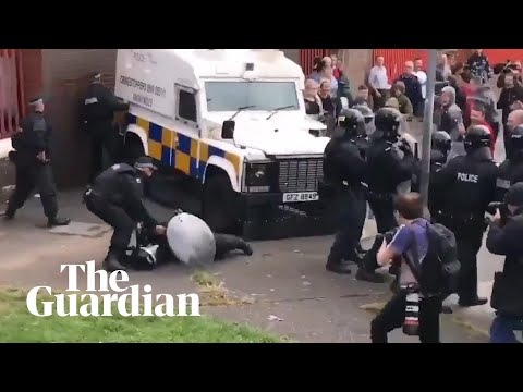 Belfast riot police clash with youths in stand-off over republican bonfire