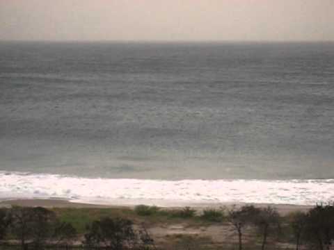 Waves crashing on shore in Malibu Ca on rainy stormy Day