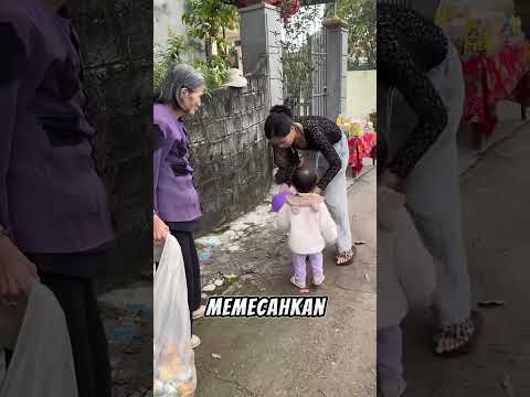 Grandma helps the little boy chase the balloon