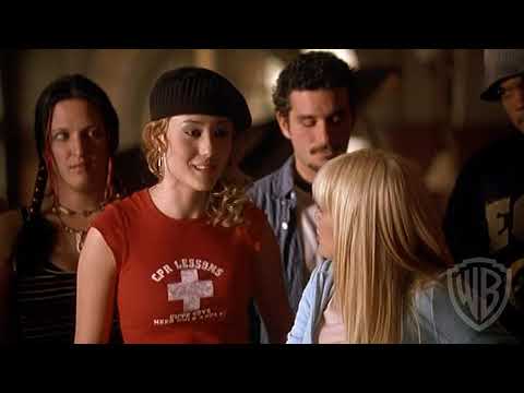 Raise Your Voice (2004) trailer still — Hilary Duff onstage, spotlight cutting through haze as the band waits for the downbeat