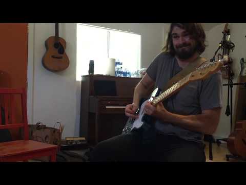 CASSIDY RED - Composer Andrew Carroll tickling the frets