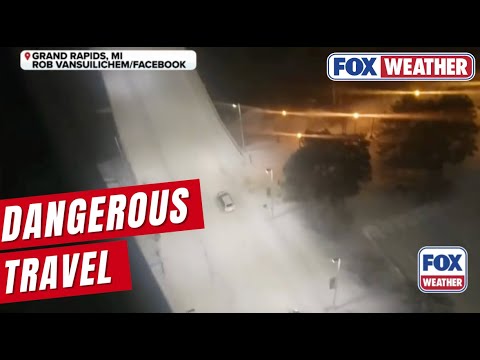Slick, Snow-covered Roads Create Dangerous Travel In Grand Rapids, Michigan