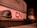 2 CN main-line freight trains moving slow together ...