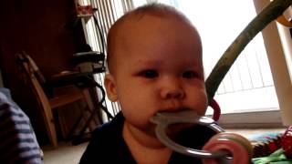2012-02-07 liam playing duck toy keys in his mouth