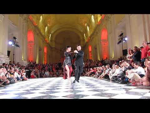  Dmitri Vasin  and  Sagdiana Hamzina  are  dancing  to  a  tango  at  Torino Tango Festival  in  2019