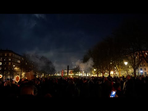 'Men in Black' hold anti vaccination demonstration in Copenhagen