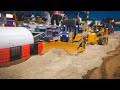 Watch These Tiny Trucks Build A Mini Road