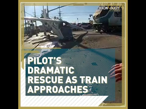 Pilot’s dramatic rescue as train approaches