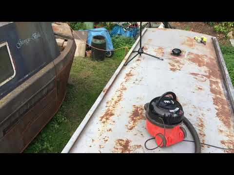 52. Painting starts on the rusty narrowboat roof. Forward handrails
