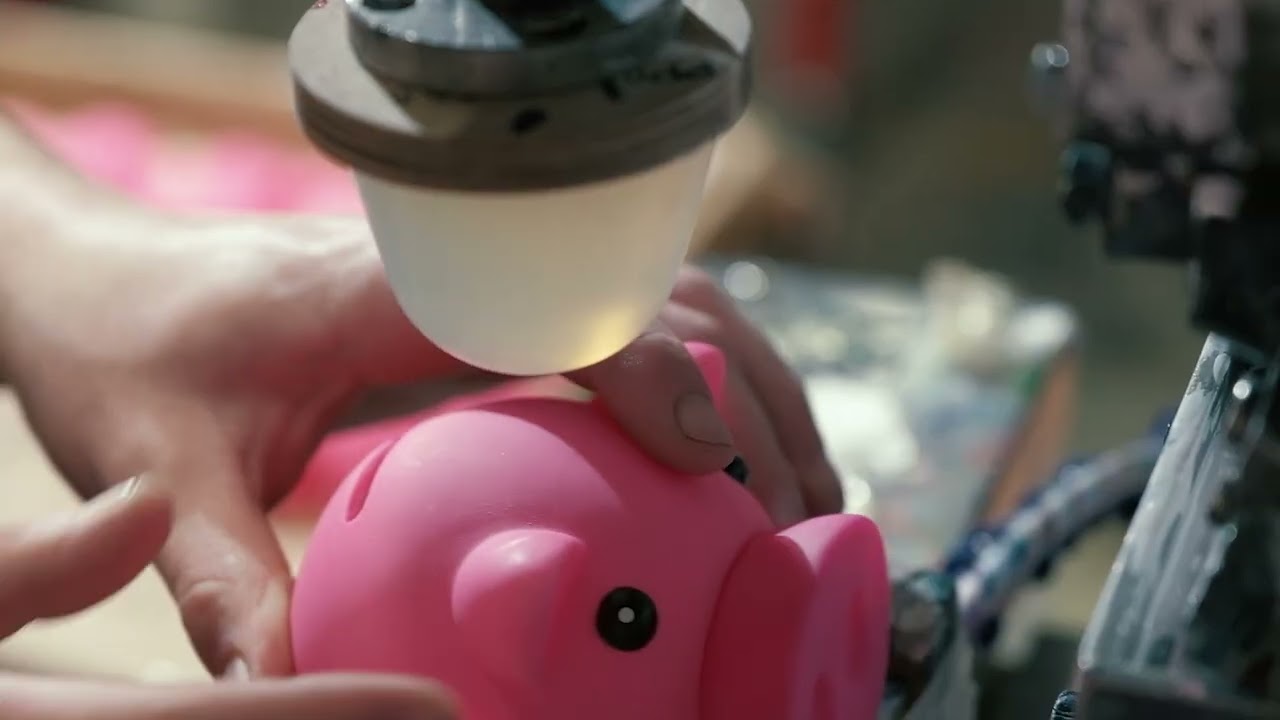 Pad printing on promotional products — ink transferred via silicone pad for precise branding on curved surfaces like pens and golf balls