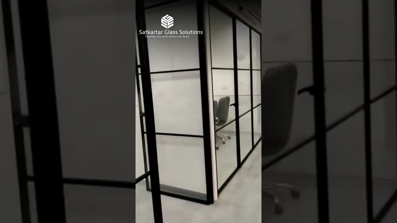 Modern Office Glass Partition with sleek door by Satkartar Glass Solutions