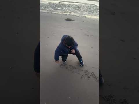 Tanzeel writing his name on the sand#explore #travel #sea #sand